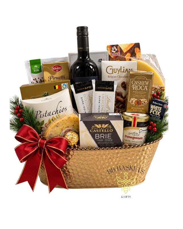Deck the Halls luxury Christmas gift basket with red wine, Guylian Belgian chocolates, Lindt dark chocolate, Brie, pistachios and gourmet treats in a hammered gold basket with red bow.