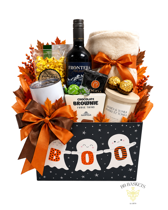 Halloween Boo Basket featuring red wine, cozy blanket, gourmet chocolates, popcorn, candle, hot cocoa and tumbler in a festive ghost-themed gift box.